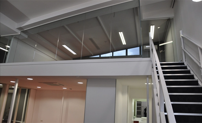 Simon Wang office space with designer furniture, flooring, suspended grid celing and glass partitions 9