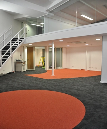 Simon Wang office space with designer furniture, flooring, suspended grid celing and glass partitions 9