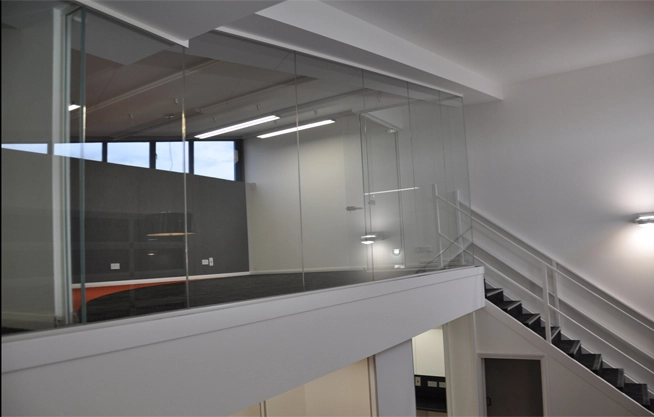 Simon Wang office space with designer furniture, flooring, suspended grid celing and glass partitions 9