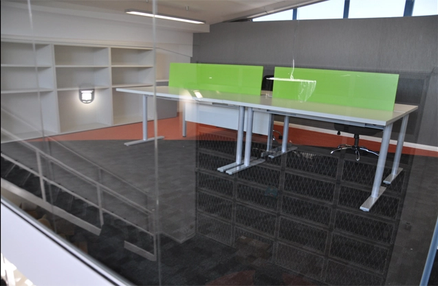 Simon Wang office space with designer furniture, flooring, suspended grid celing and glass partitions 8