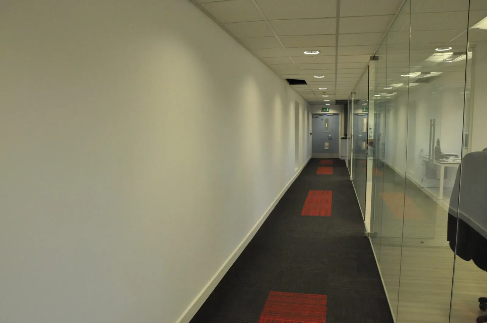 Tansales office with single glazed with frameless doors glass partitions and desinger furniture 14