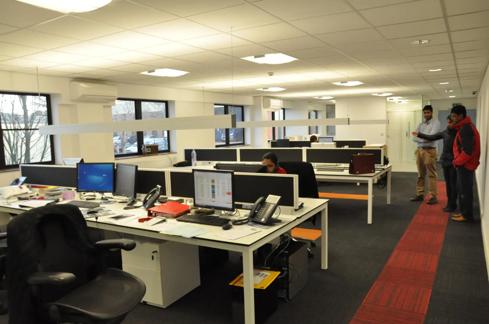 Tansales office with single glazed with frameless doors glass partitions and desinger furniture 15