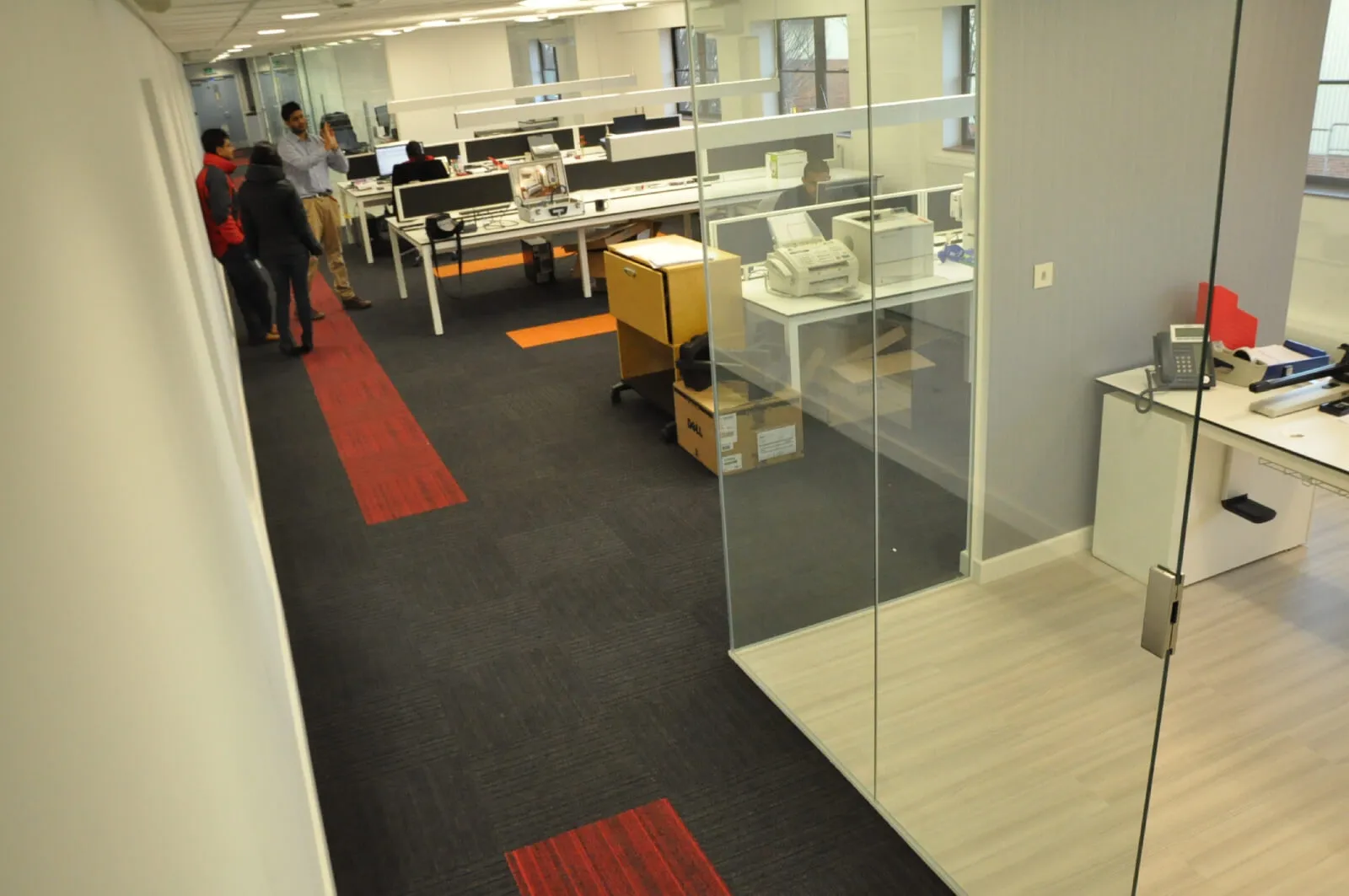 Tansales office with single glazed with frameless doors glass partitions and desinger furniture 18
