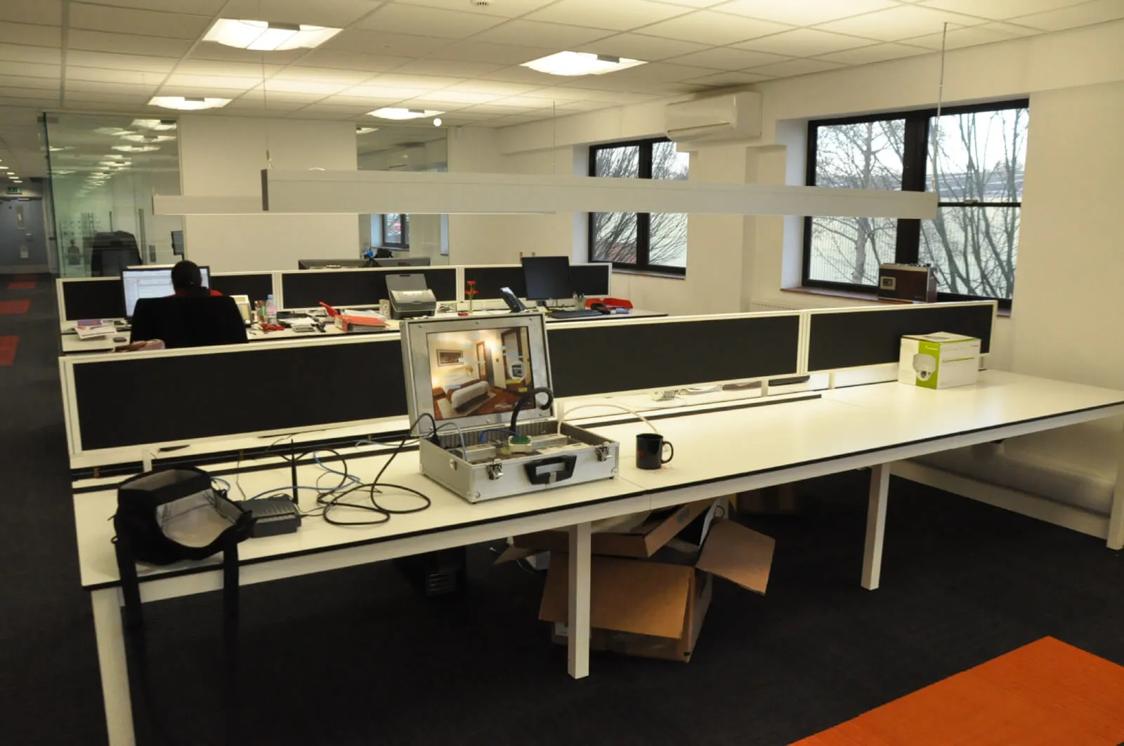 Tansales office with single glazed with frameless doors glass partitions and desinger furniture 19