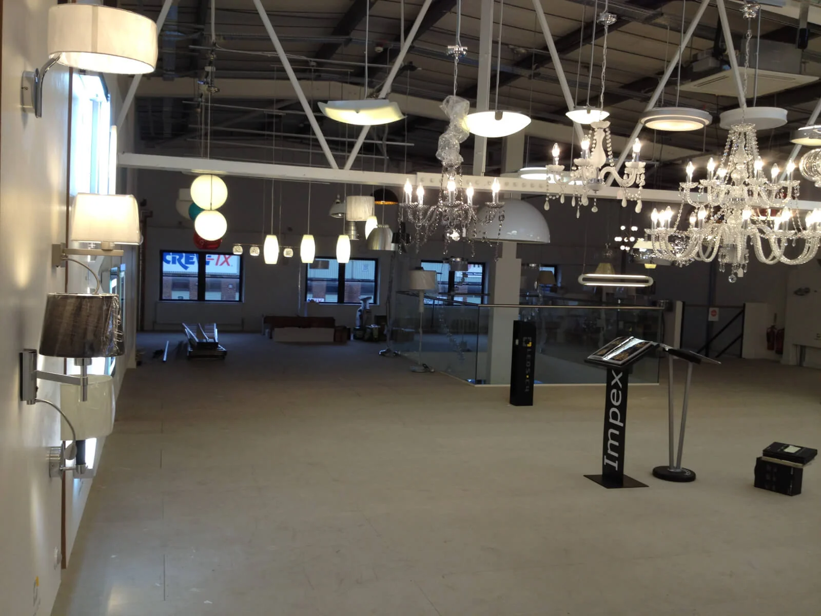 Tansales office with single glazed with frameless doors glass partitions and desinger furniture 42