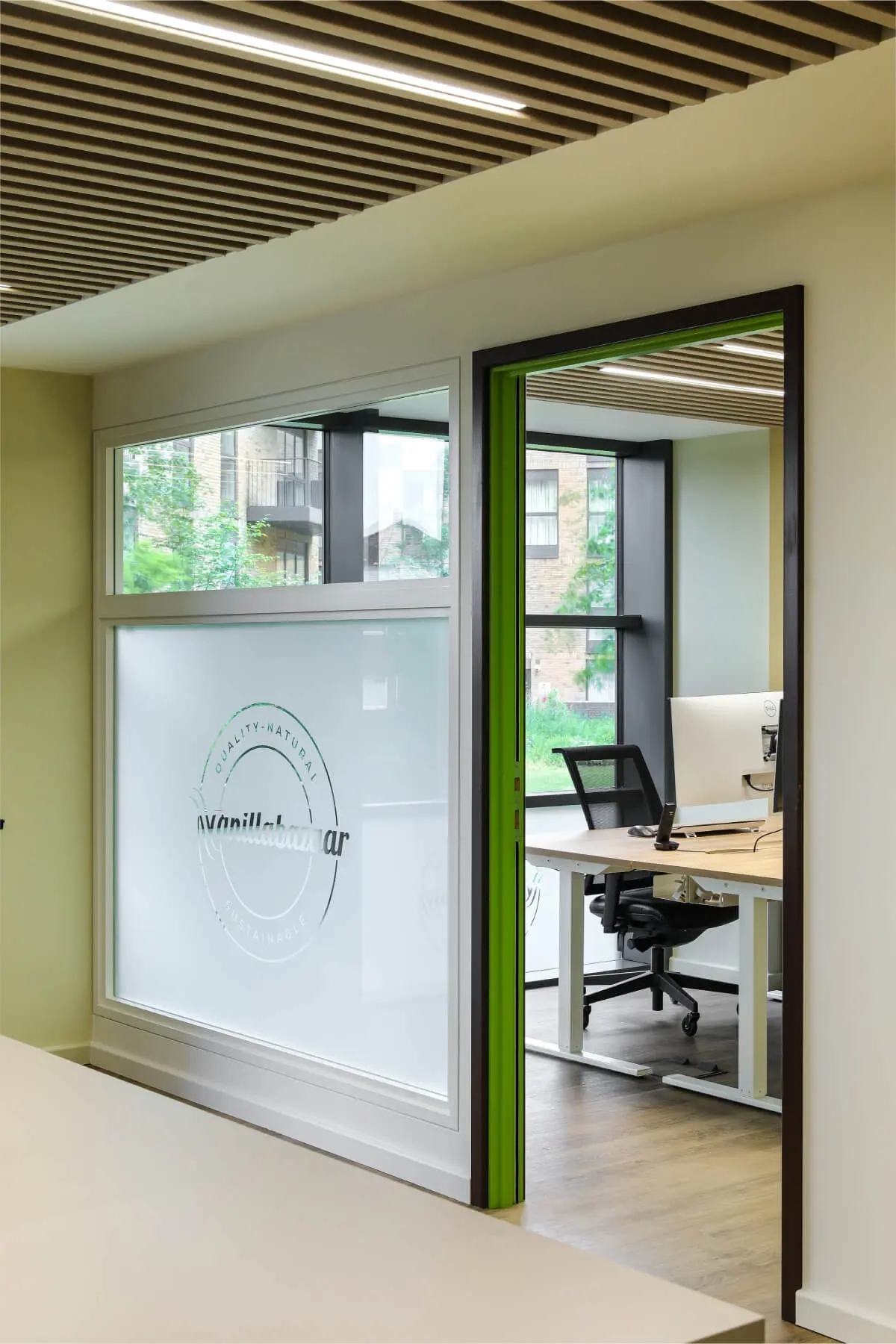 Vanilla Bazaar office space with designer furniture, laminated wood flooring, ceiling and glass partitions 19