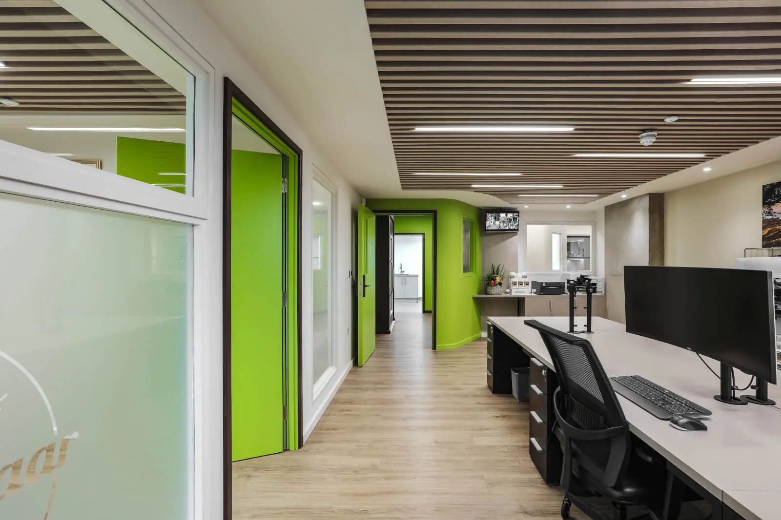 Vanilla Bazaar office space with designer furniture, laminated wood flooring, ceiling and glass partitions 22