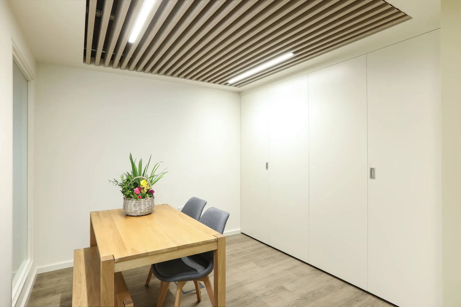 Vanilla Bazaar office space with designer furniture, laminated wood flooring, ceiling and glass partitions 24