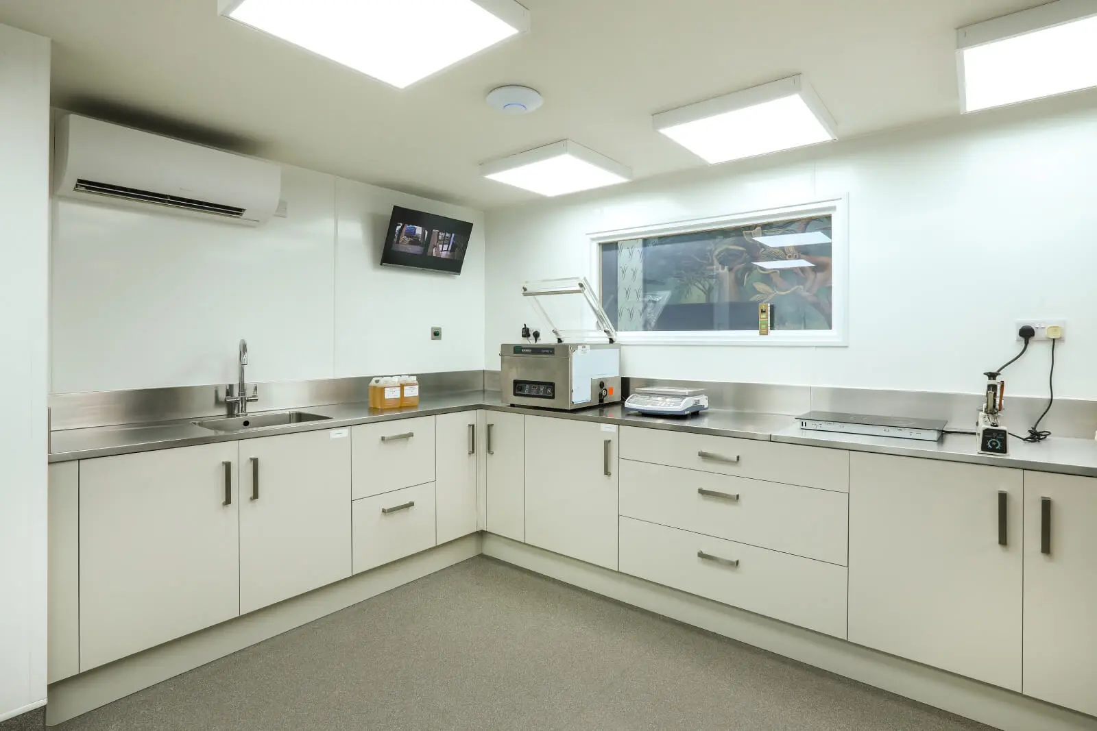 Vanilla Bazaar office space with designer furniture, laminated wood flooring, ceiling and glass partitions 5