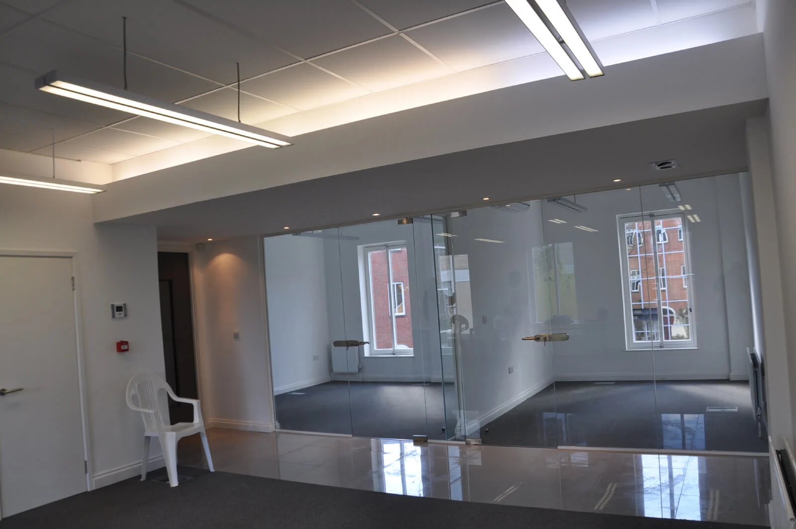 World Sim office with single glazed with frameless doors glass partitions and desinger furniture 5