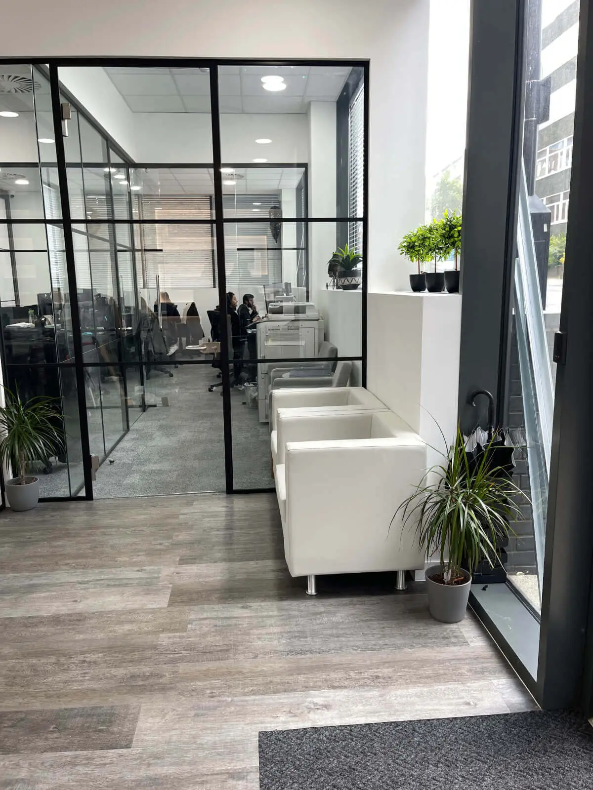 Carter Bond space design with suspended grid ceiling black framed glass partitions 18