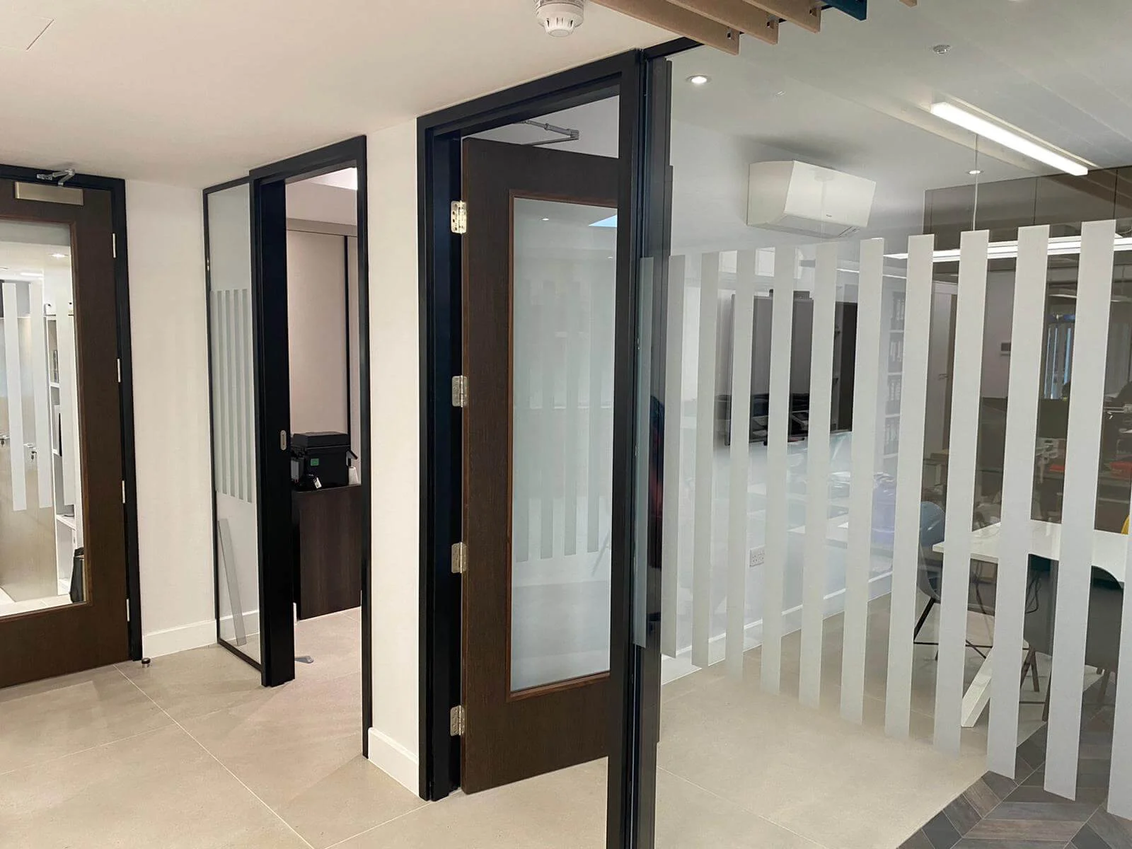 Deekay Group office space with deisgner furniture, walls and glass partitions