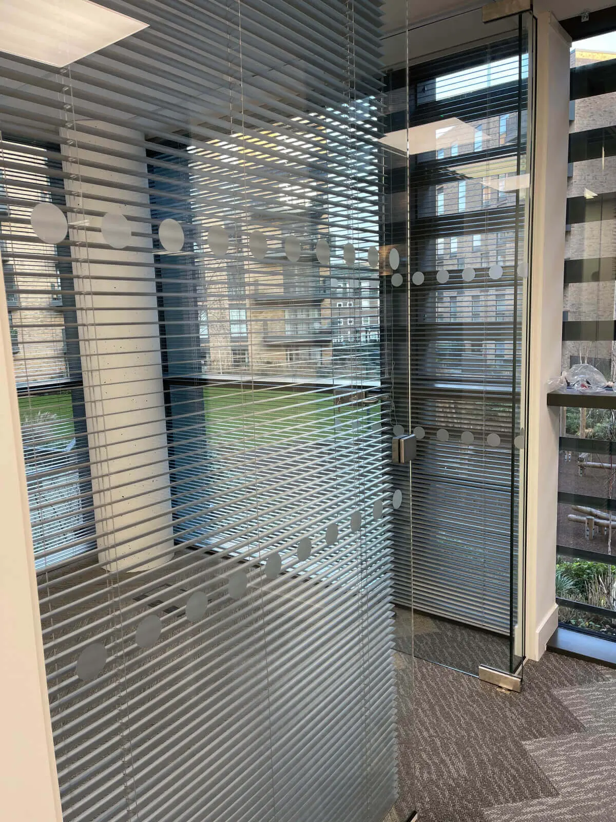 Hemsley Miller office space with designer flooring, funriture and single glazed glass partitions 12
