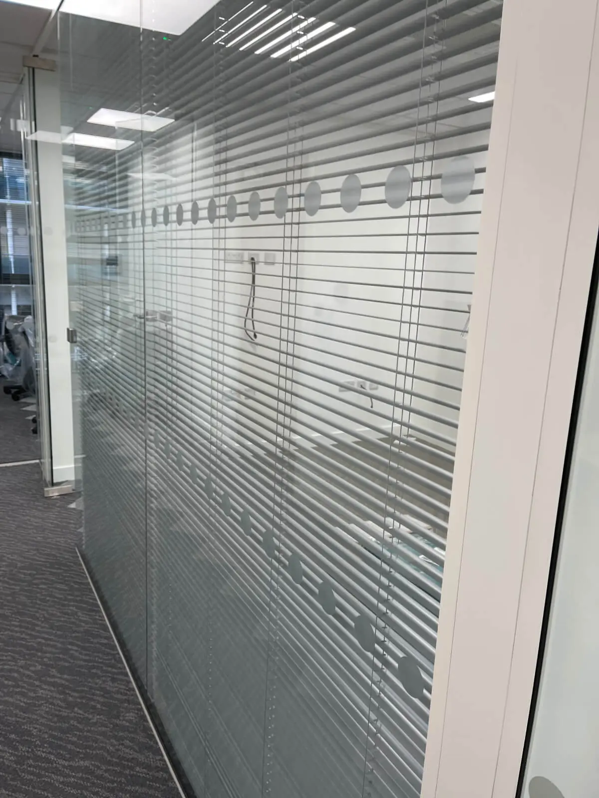 Hemsley Miller office space with designer flooring, funriture and single glazed glass partitions 8