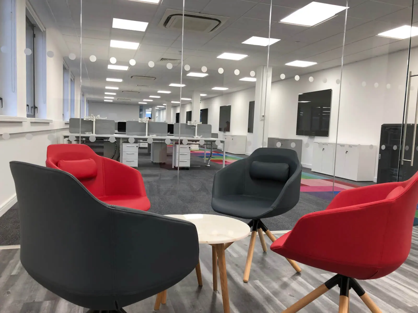 Ngage Recruitment office space with designer furniture and glass partitions and carpet tile flooring along with suspended grid ceiling 1