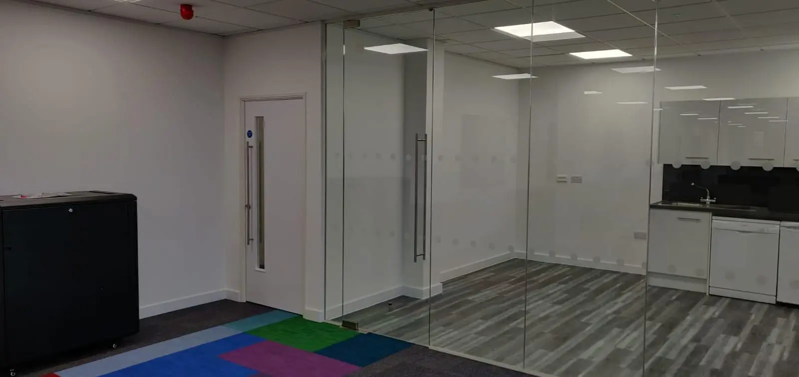 Ngage Recruitment office space with designer furniture and glass partitions and carpet tile flooring along with suspended grid ceiling 2
