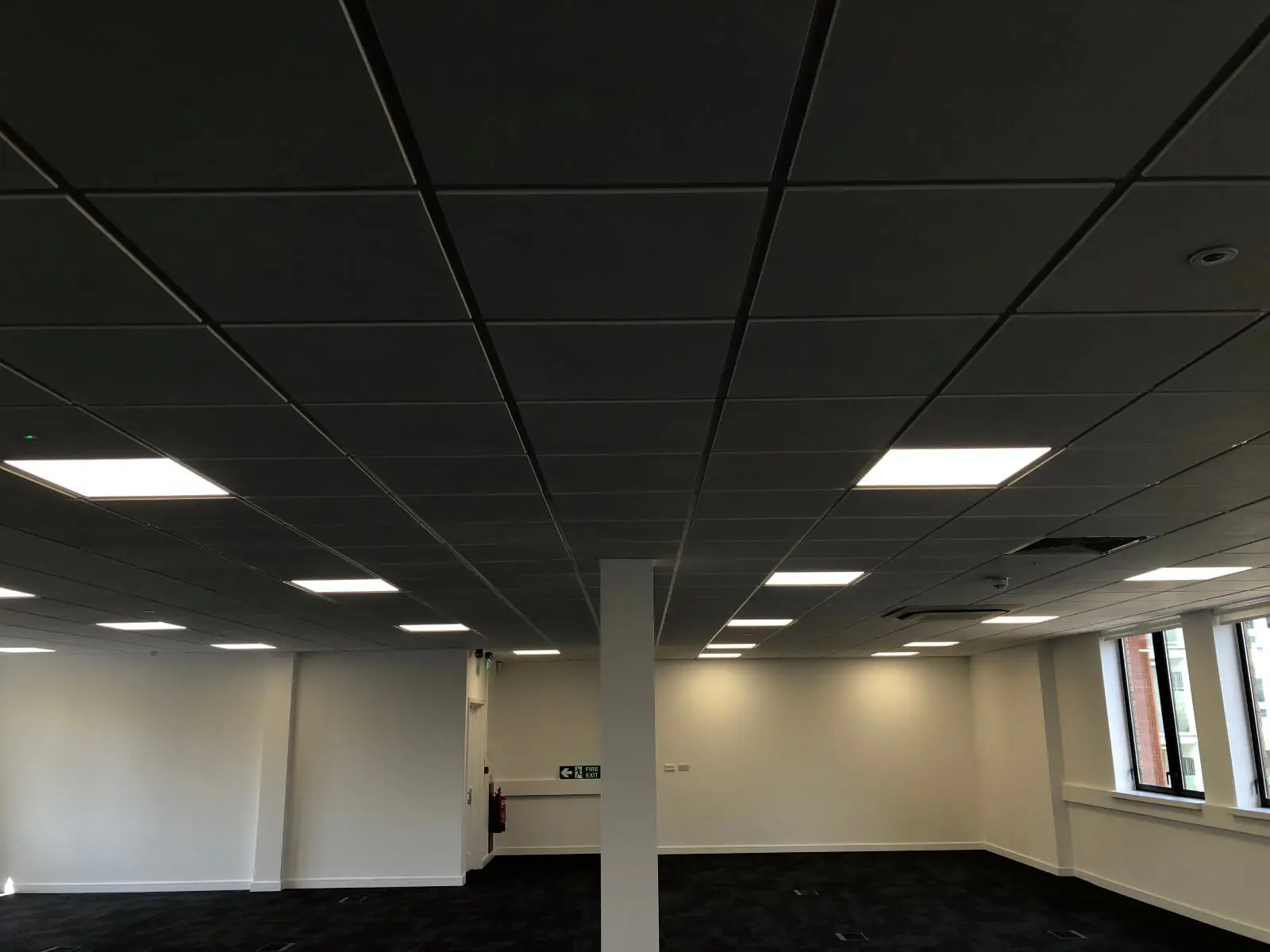 Ngage Recruitment office space with designer furniture and glass partitions and carpet tile flooring along with suspended grid ceiling 3
